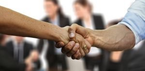 Client and professional shaking hands in the workplace