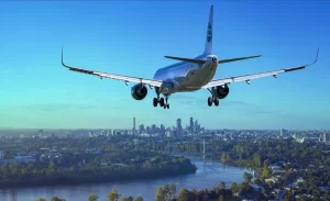 aeroplane landing in a city
