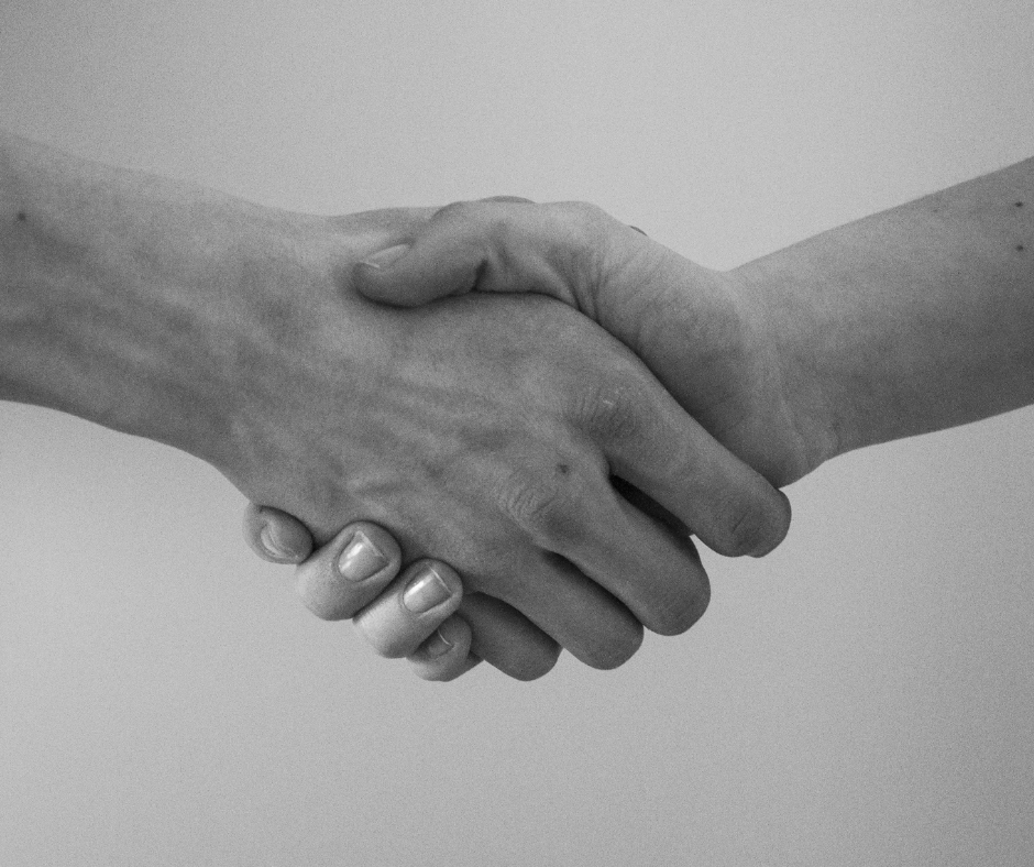 Agreement between two nation shown as a handshake Agreement between two nation shown as a handshake