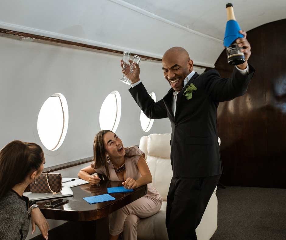 high income earners celebrating in a private plane with champagne and two ladies