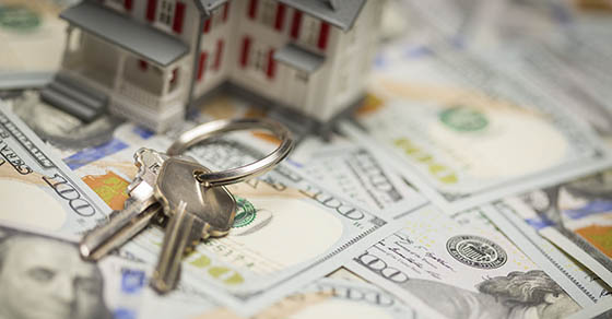 Small Model House and Keys on Newly Designed U.S. One Hundred Dollar Bills.