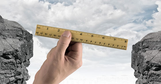 transfer pricing being shown as a ruler between two ledges transfer pricing being shown as a ruler between two ledges