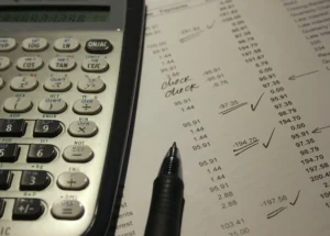 financial statement being rectified by pen and paper instead of a pdf editor