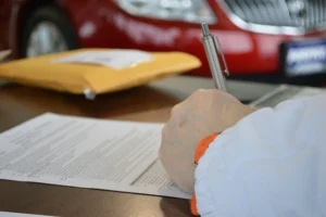 man filling up a legal form