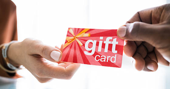 Close-up,Of,Two,people,Hand,Holding,Red,Gift,Card Close-up Of Two people Hand Holding Red Gift Card